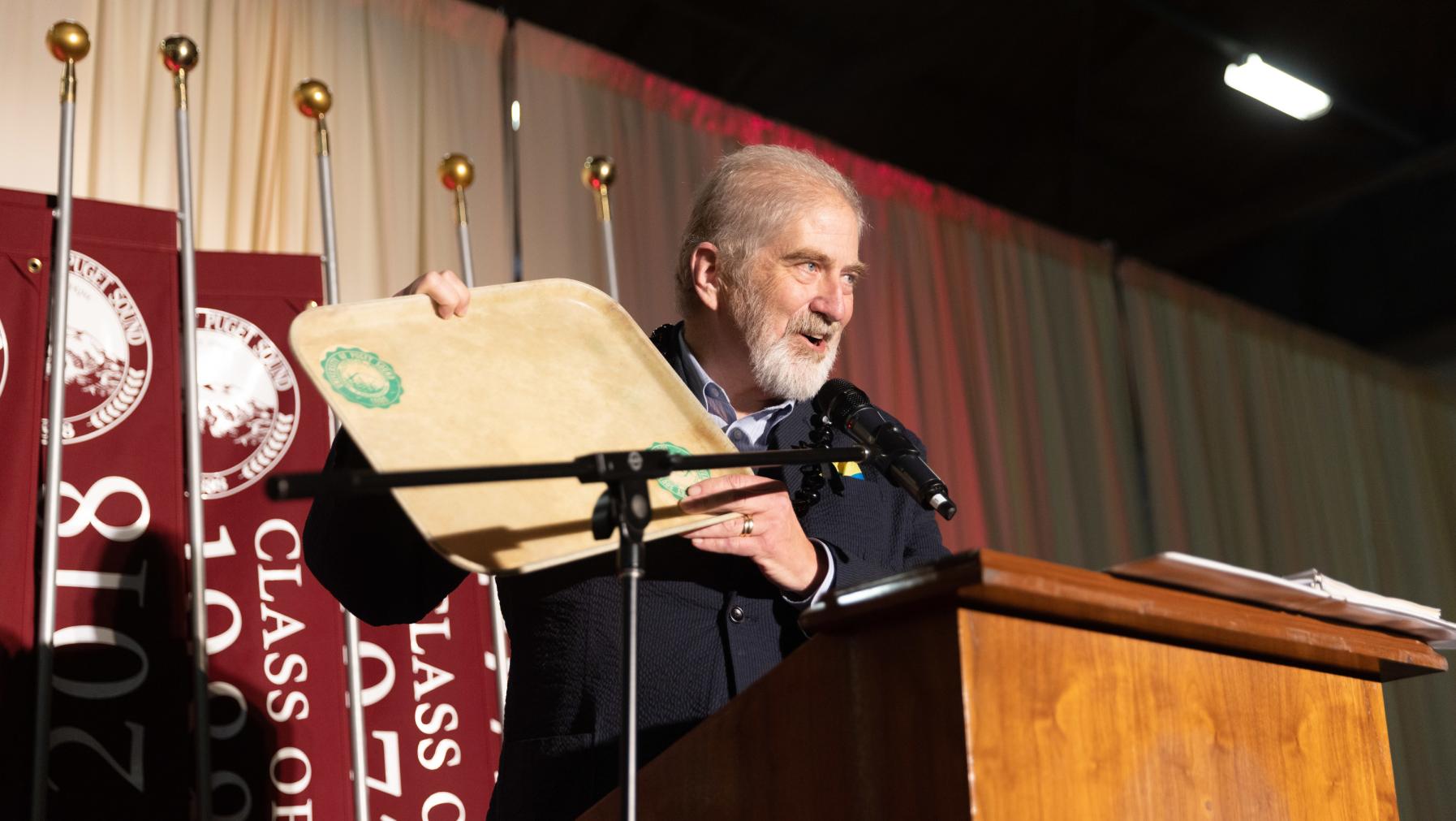 Houston Dougherty with a serving tray from the Diner that he returned at the Alumni Awards ceremony.