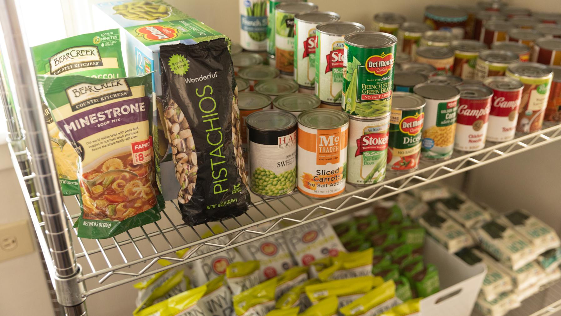 Canned items on a shelf in the Campus Food Pantry.