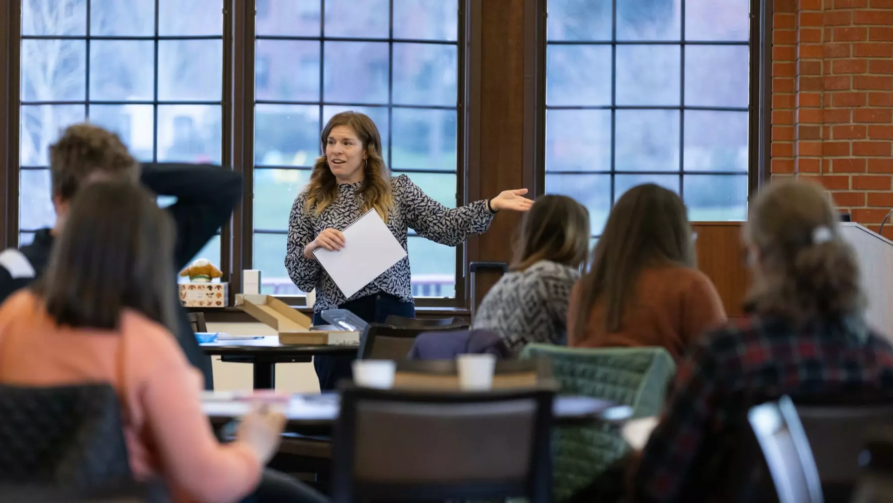 woman speaking to a group of people