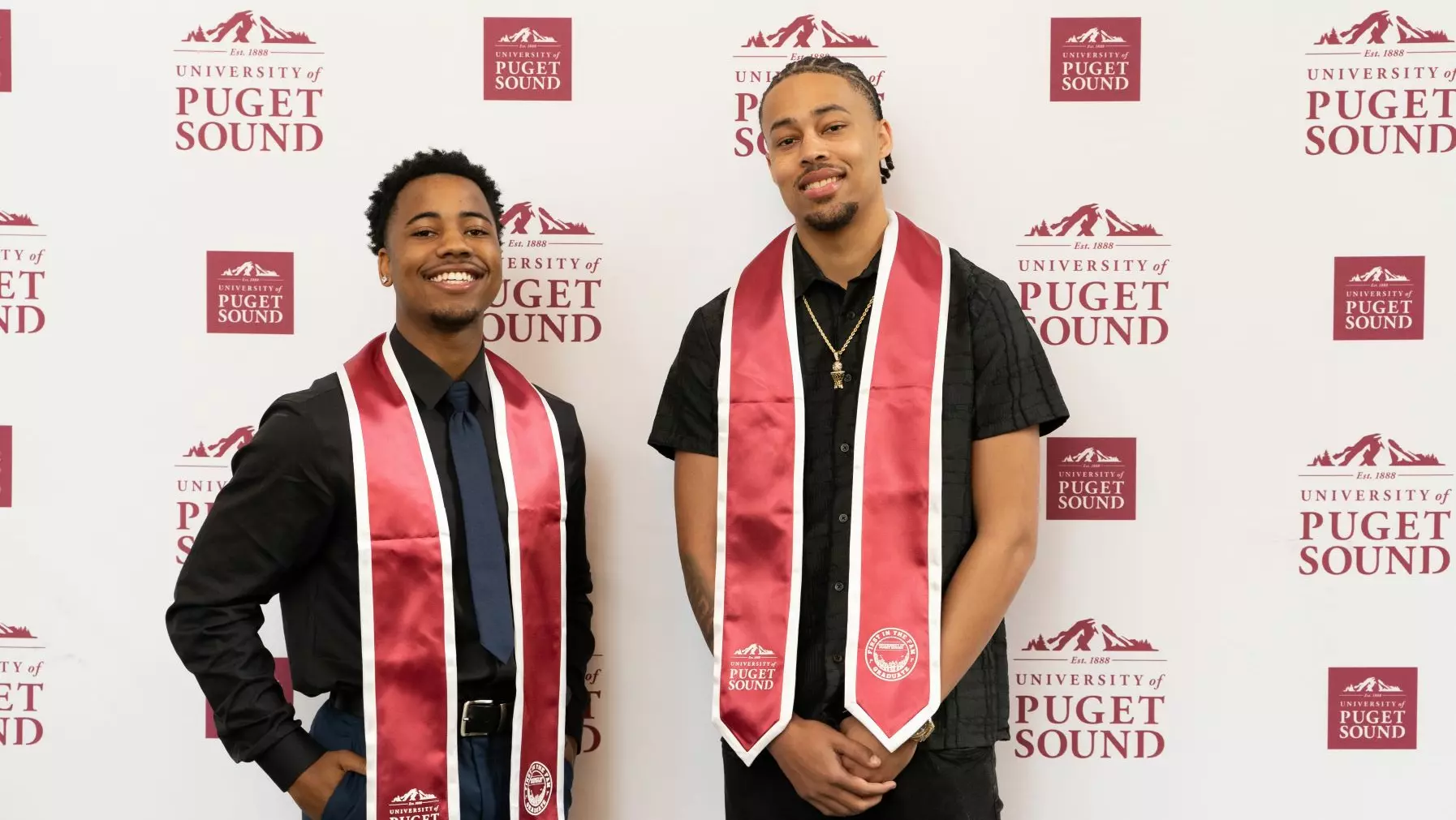 Two first gen grads in their regalia