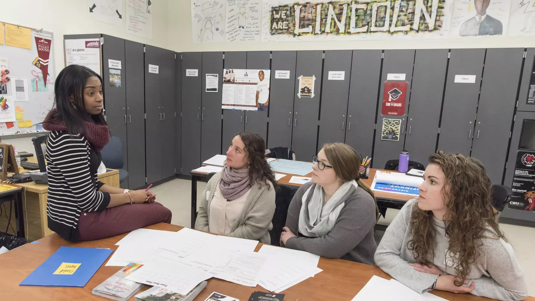 Students in a local classroom with an MAT alum.