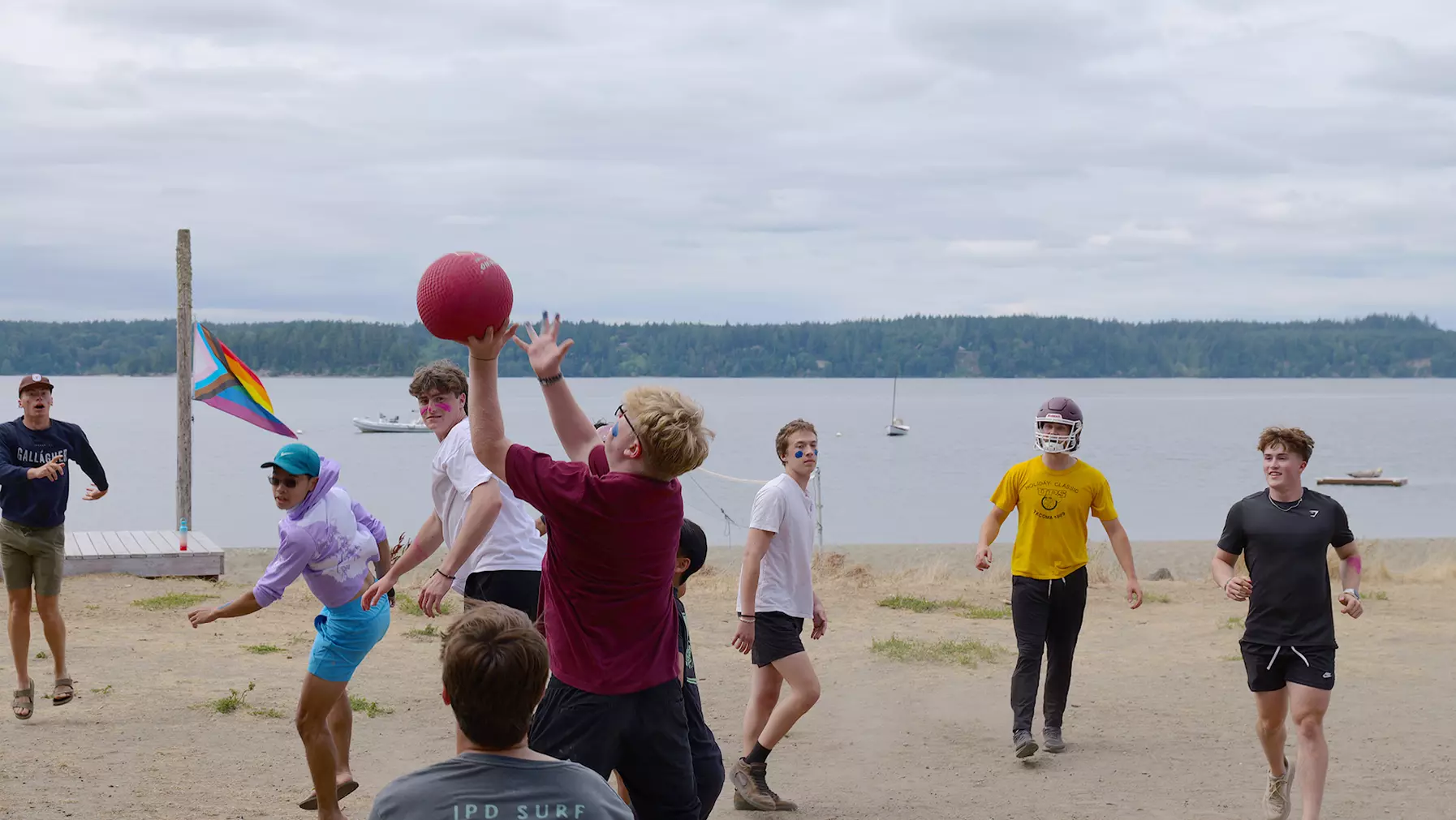 Student leader group playing volleyball at the beach