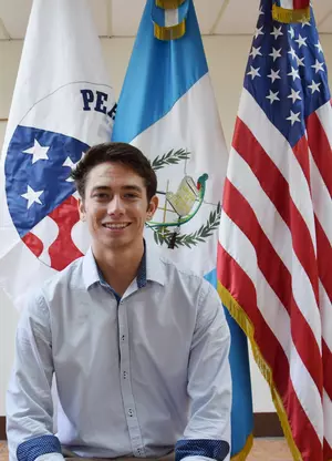 2016 Psychology graduate Nic Navarro smiling at the camera