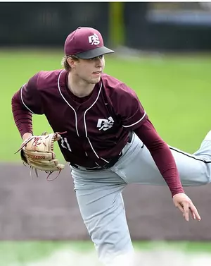 A pitcher throws the ball