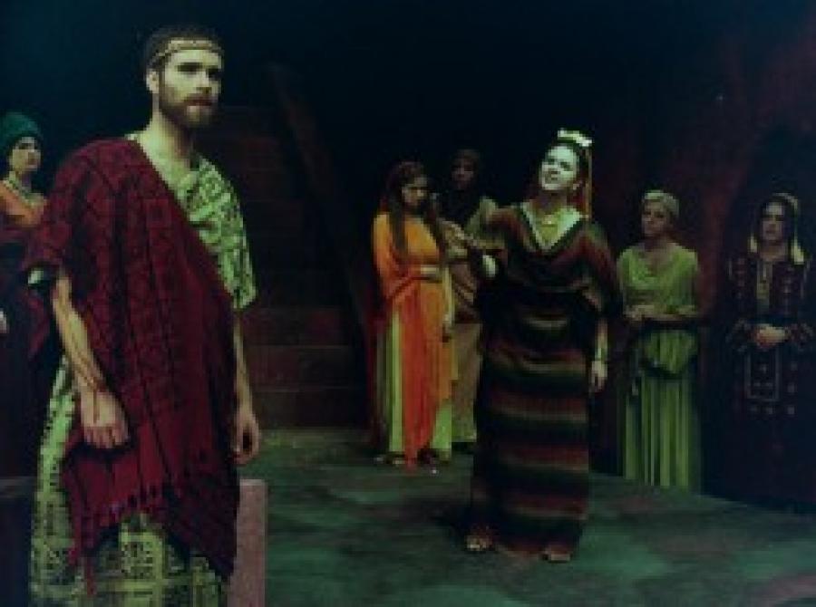 Actors on stage in costume for performance